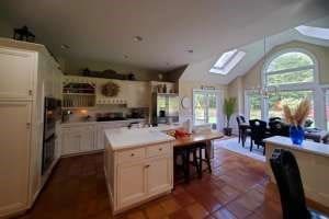 kitchen with a center island and lofted ceiling with skylight