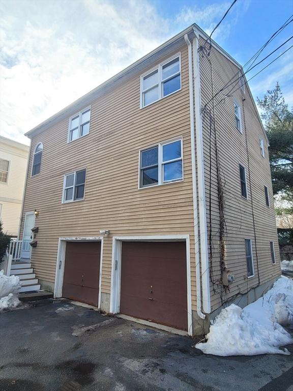 exterior space with a garage and driveway