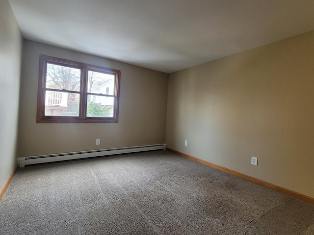 carpeted empty room featuring baseboards and baseboard heating