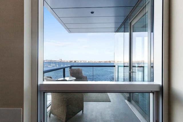 balcony featuring a water view