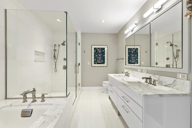 bathroom with tile patterned floors, vanity, toilet, and a shower with shower door