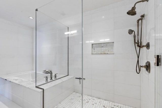 bathroom featuring shower with separate bathtub