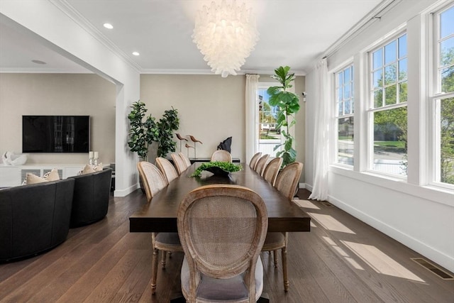 dining room with crown molding, baseboards, plenty of natural light, and dark wood-style flooring