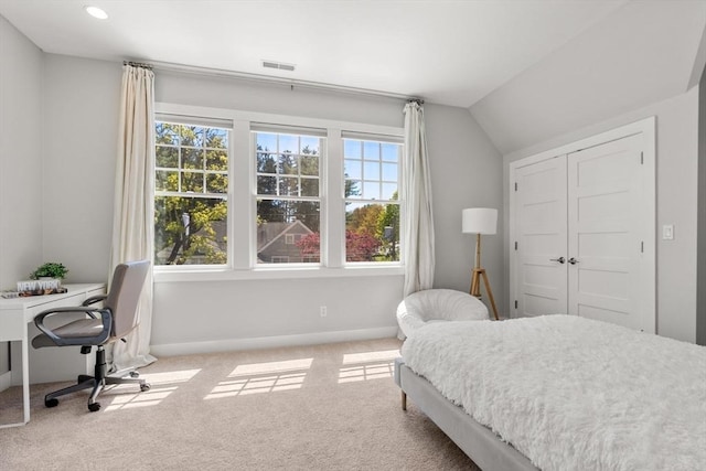 carpeted bedroom featuring visible vents, baseboards, a closet, lofted ceiling, and recessed lighting