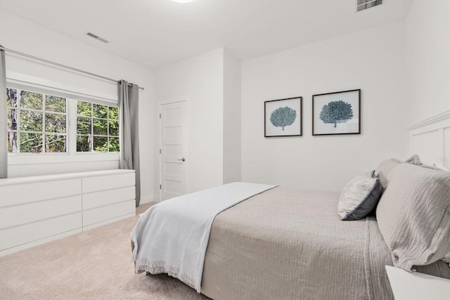 bedroom featuring visible vents and carpet