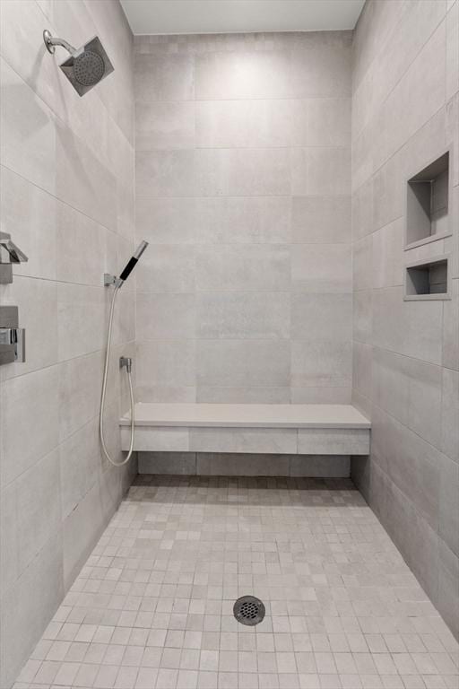 bathroom featuring tiled shower