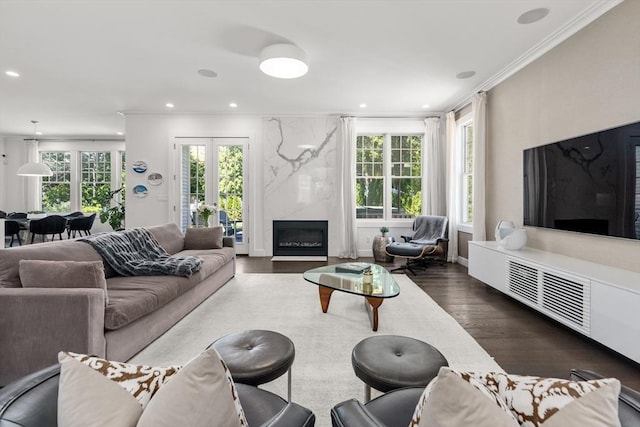 living area featuring recessed lighting, ornamental molding, and dark wood finished floors