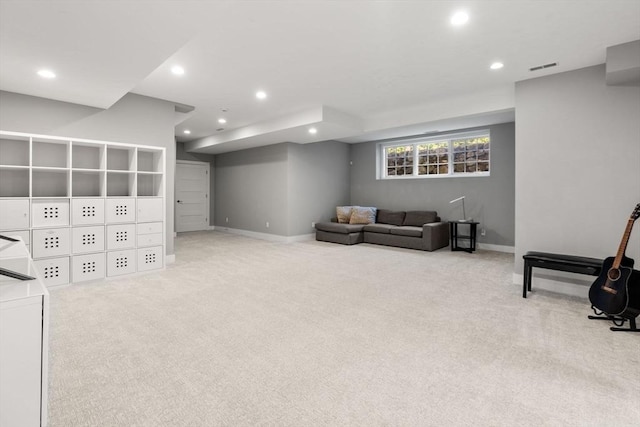 carpeted living room with baseboards, recessed lighting, and visible vents