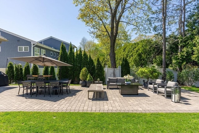 view of patio / terrace featuring fence and an outdoor hangout area