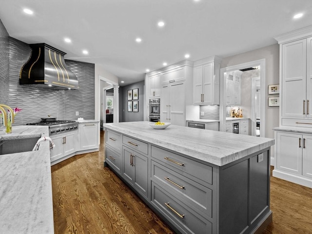 17 Olde Hickory Path, Westborough, MA 01581 - kitchen featuring gray cabinets, ventilation hood, white cabinetry, stainless steel gas stovetop, and backsplash