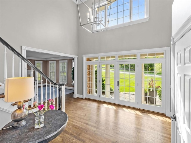 17 Olde Hickory Path, Westborough, MA 01581 - entryway featuring a high ceiling, stairway, wood finished floors, and a chandelier
