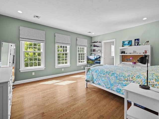 17 Olde Hickory Path, Westborough, MA 01581 - bedroom with multiple windows, wood finished floors, and recessed lighting