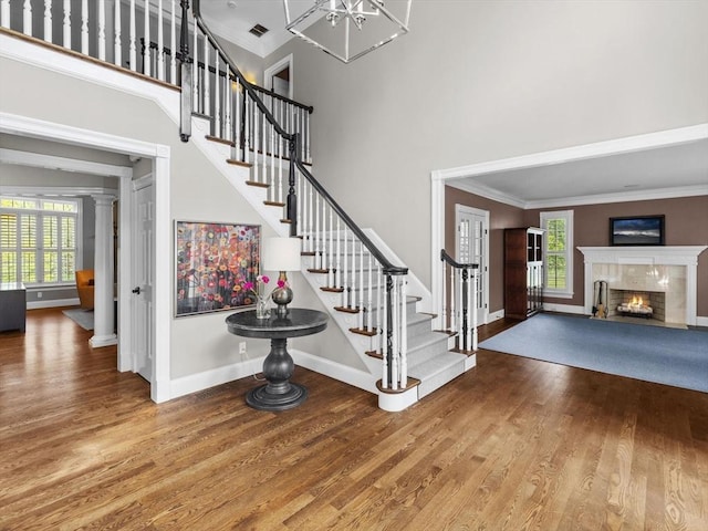 17 Olde Hickory Path, Westborough, MA 01581 - foyer featuring stairway, wood finished floors, plenty of natural light, a high ceiling, and crown molding