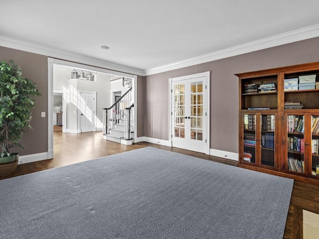 17 Olde Hickory Path, Westborough, MA 01581 - spare room featuring french doors, stairs, crown molding, and wood finished floors