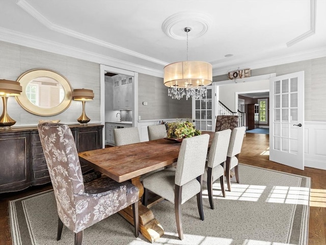 17 Olde Hickory Path, Westborough, MA 01581 - dining room featuring a chandelier, wood finished floors, crown molding, stairs, and a wainscoted wall