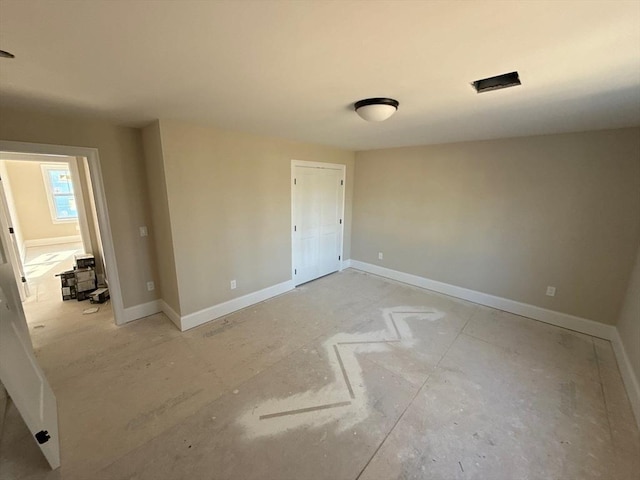 empty room with baseboards