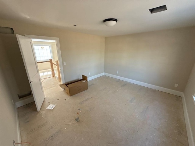 empty room with baseboards
