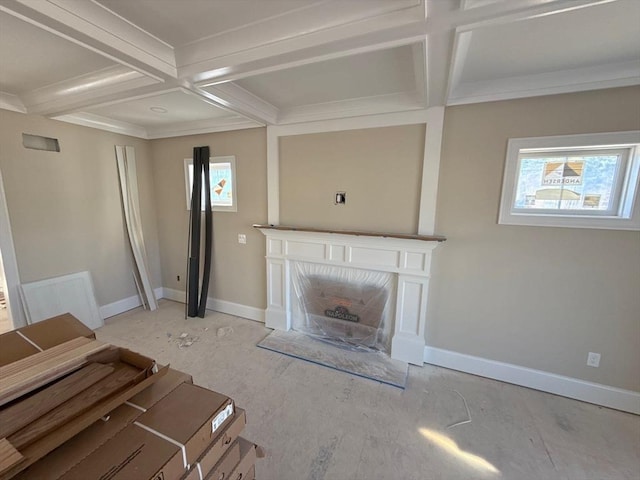 unfurnished living room with beamed ceiling, baseboards, coffered ceiling, and a fireplace with flush hearth