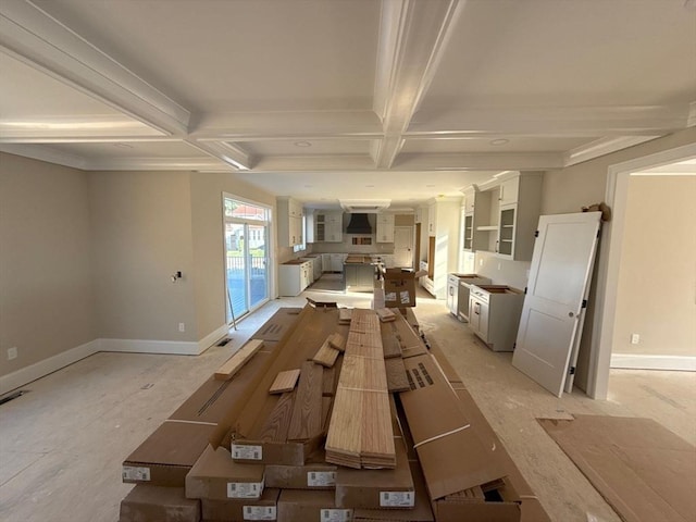 interior space featuring beam ceiling, baseboards, and coffered ceiling