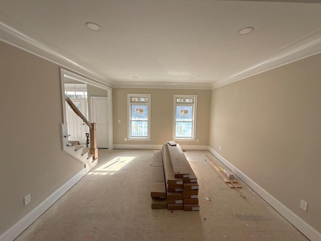 unfurnished room with stairway, baseboards, and crown molding