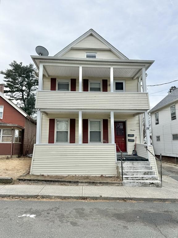 view of front of house with a porch and a balcony