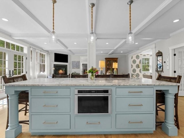 35 Forster Rd, Manchester, MA 01944 - kitchen featuring oven, coffered ceiling, healthy amount of natural light, blue cabinetry, and open floor plan