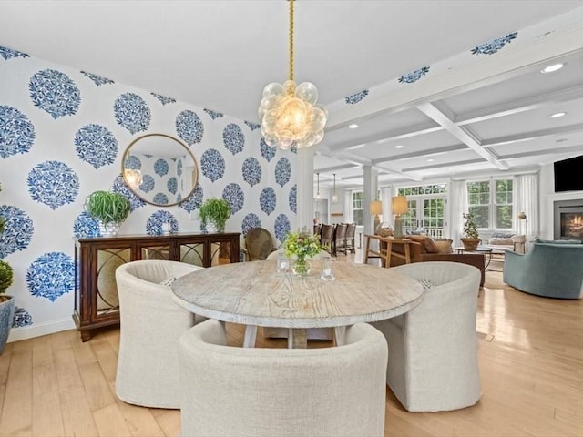 35 Forster Rd, Manchester, MA 01944 - dining area featuring coffered ceiling, light wood-style floors, beam ceiling, recessed lighting, and a warm lit fireplace
