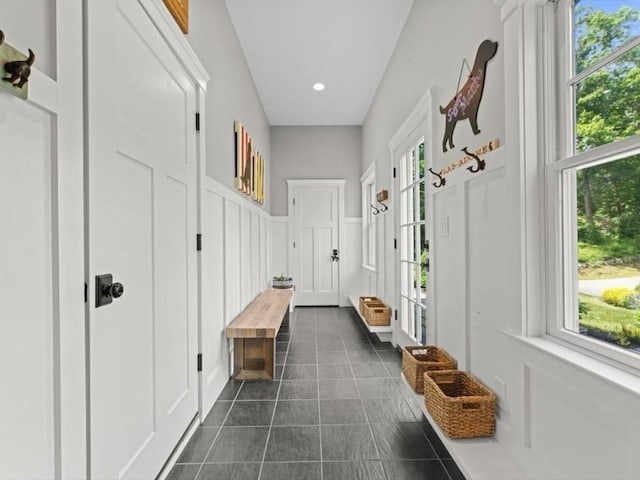 35 Forster Rd, Manchester, MA 01944 - mudroom featuring dark tile patterned floors, a decorative wall, and recessed lighting