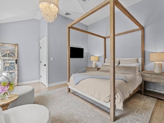 35 Forster Rd, Manchester, MA 01944 - bedroom featuring a chandelier, vaulted ceiling, and wood finished floors