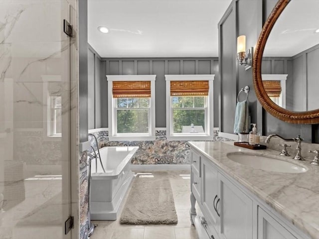 35 Forster Rd, Manchester, MA 01944 - full bath featuring vanity, a marble finish shower, a soaking tub, recessed lighting, and tile patterned flooring