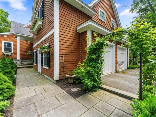 35 Forster Rd, Manchester, MA 01944 - view of property exterior with driveway and an attached garage