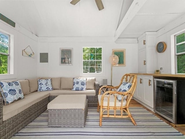 35 Forster Rd, Manchester, MA 01944 - living room featuring beverage cooler, plenty of natural light, wood finished floors, and ceiling fan