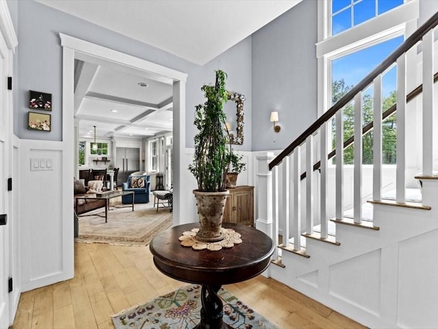 35 Forster Rd, Manchester, MA 01944 - foyer entrance featuring coffered ceiling, light wood-type flooring, stairway, plenty of natural light, and beamed ceiling