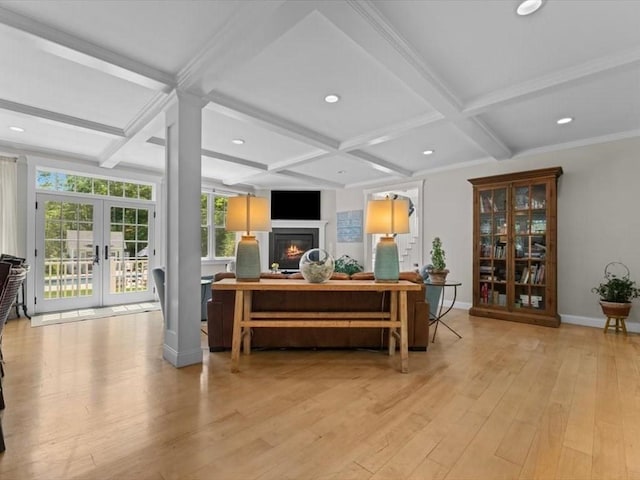 35 Forster Rd, Manchester, MA 01944 - reception featuring coffered ceiling, french doors, a glass covered fireplace, beamed ceiling, and recessed lighting