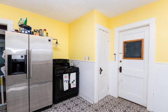 57 Ardale St, Boston, MA 02131 - kitchen featuring stainless steel fridge with ice dispenser, black gas stove, and wainscoting