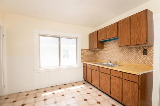 57 Ardale St, Boston, MA 02131 - kitchen featuring a sink, light countertops, light floors, and brown cabinets