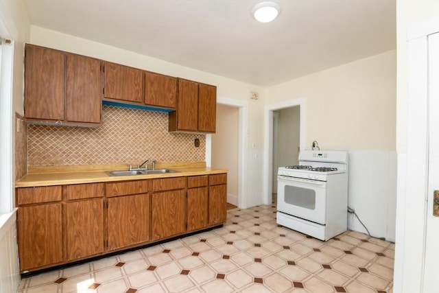 57 Ardale St, Boston, MA 02131 - kitchen featuring white gas range, a sink, light floors, and light countertops