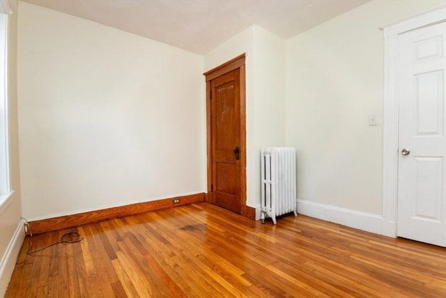 57 Ardale St, Boston, MA 02131 - unfurnished room featuring radiator heating unit, light wood finished floors, and baseboards