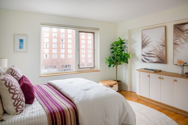 bedroom featuring light wood-type flooring