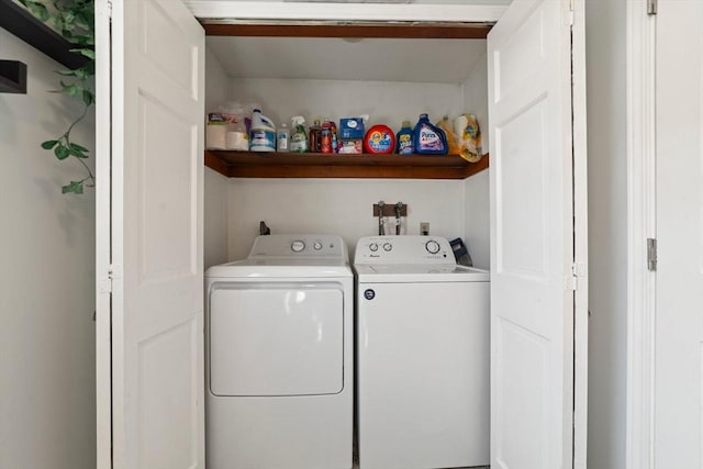 clothes washing area featuring laundry area and washing machine and dryer