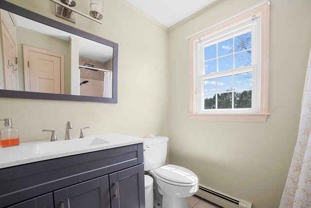bathroom featuring crown molding, vanity, toilet, baseboard heating, and tile patterned floors