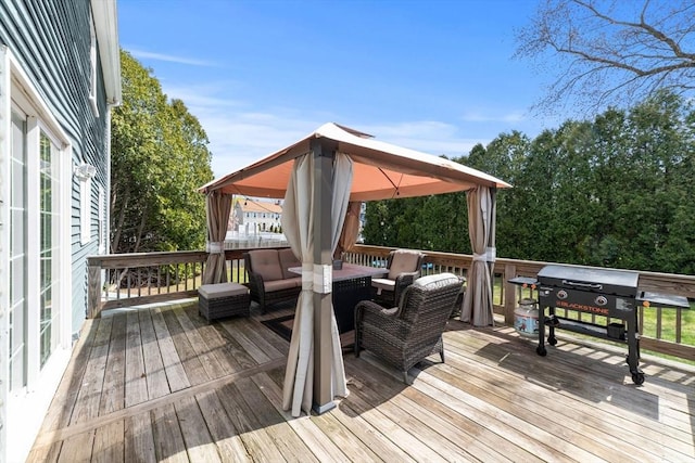 wooden deck featuring a gazebo