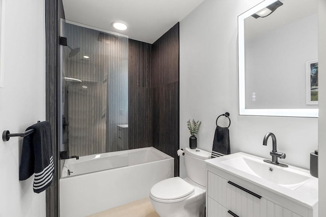 bathroom featuring vanity, shower / bathing tub combination, and toilet