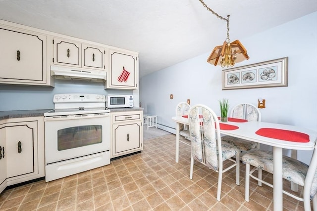 kitchen with hanging light fixtures, white appliances, dark countertops, and under cabinet range hood