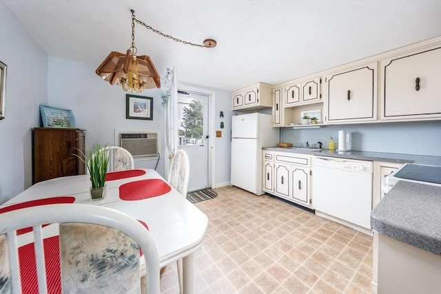 kitchen with light floors, open shelves, a wall mounted AC, a chandelier, and white appliances