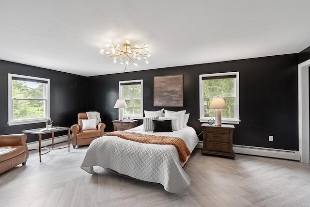 82 Powow St, Amesbury, MA 01913 - bedroom featuring baseboard heating, a chandelier, and a baseboard heating unit