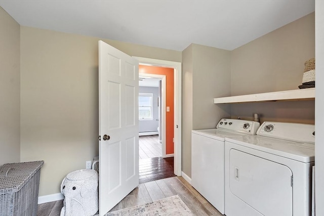 82 Powow St, Amesbury, MA 01913 - laundry room featuring washing machine and clothes dryer, light wood-style floors, and baseboard heating