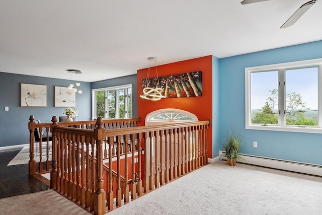 82 Powow St, Amesbury, MA 01913 - stairway featuring carpet, ceiling fan, and a baseboard heating unit
