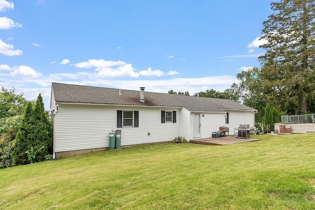 82 Powow St, Amesbury, MA 01913 - rear view of house with a yard and a deck