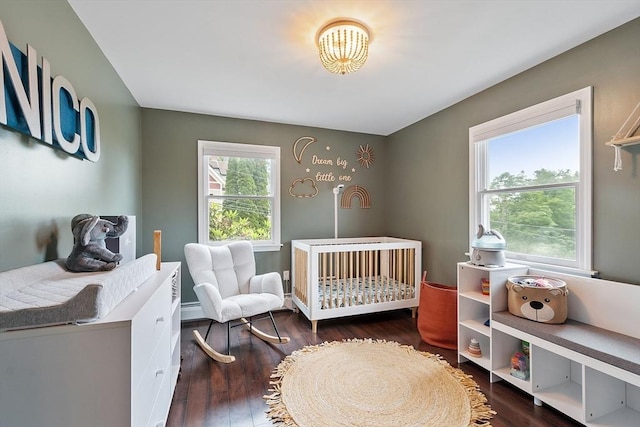 82 Powow St, Amesbury, MA 01913 - bedroom featuring a nursery area and wood finished floors